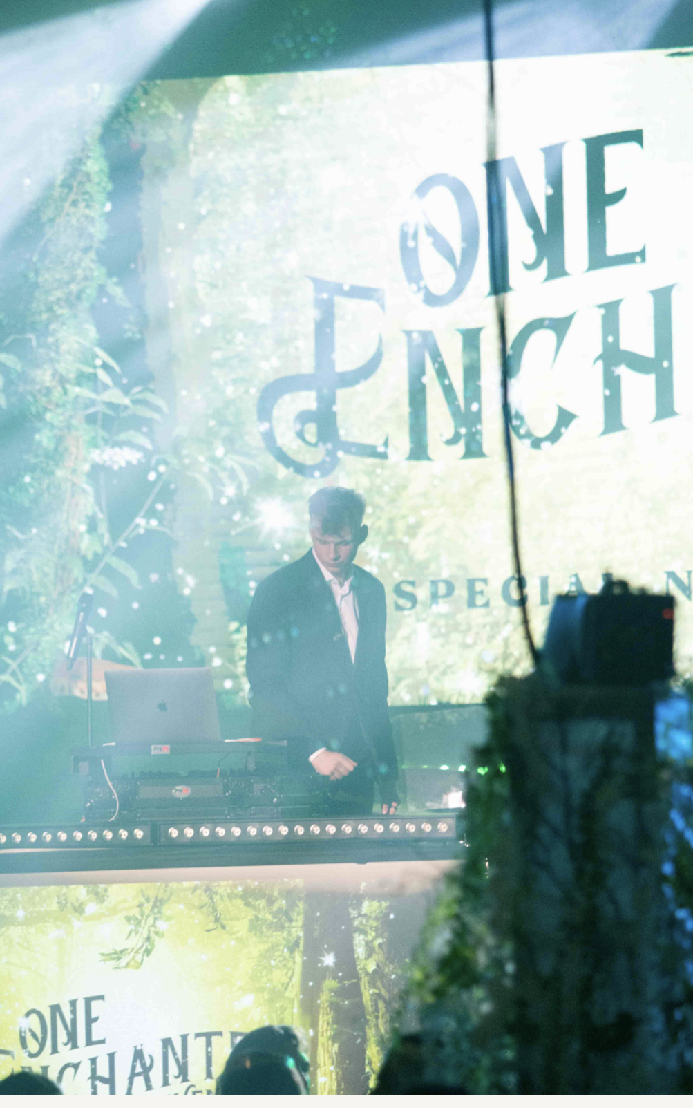 Enchanted-themed DJ stage with projection